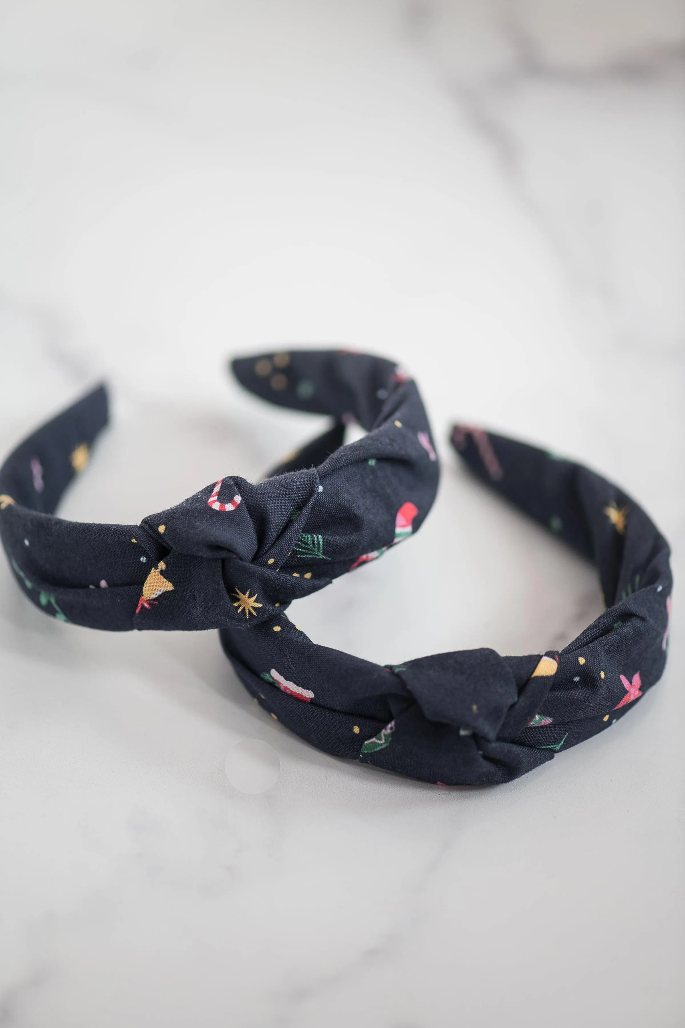 The Tiny Tassel Headband in Holiday Icon Print